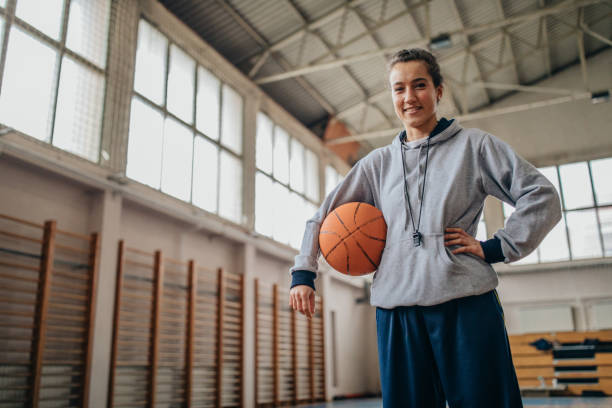 istock Female coach with basketball ball 1131834818