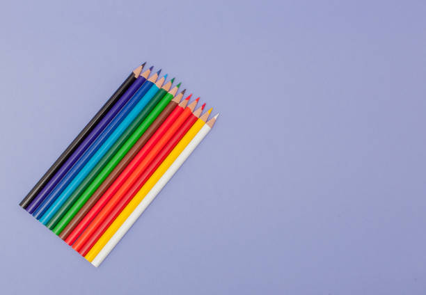 istock Color Pencils on violet Background for Projects and Announcements 1131838459