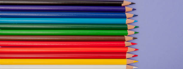 istock Color Pencils on violet Background for Projects and Announcements 1131838464