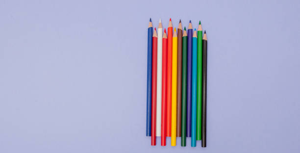istock Color Pencils on violet Background for Projects and Announcements 1131838506