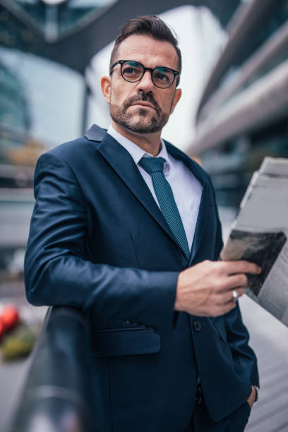 istock Businessman reading newspaper 1131838979