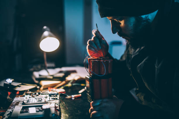 Man making bomb Man making time bomb at night bomb stock pictures, royalty-free photos & images