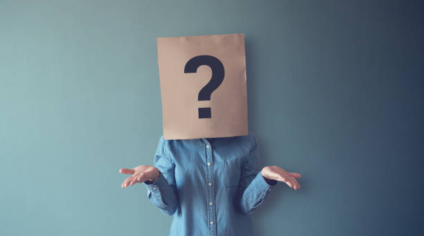 woman has confused, thinking, question mark icon on paper bag, copy space. - uncertainty imagens e fotografias de stock