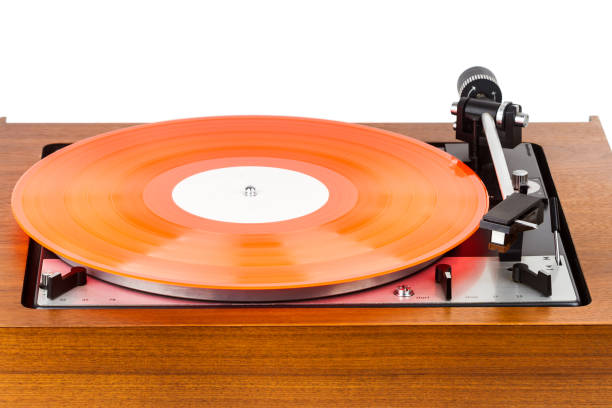 istock Vintage turntable with a red vinyl isolated on white 1131845164