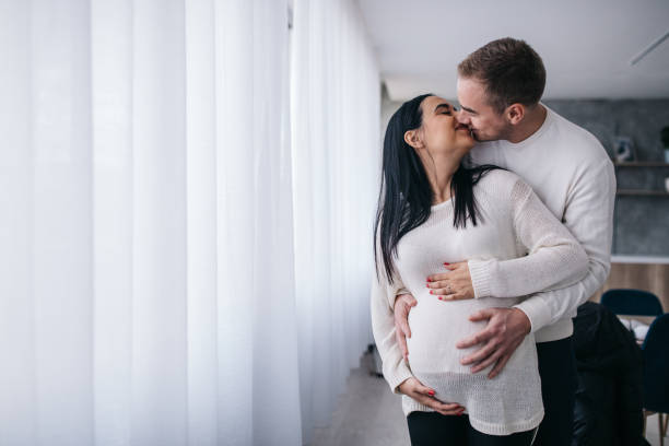 Parents touching pregnant belly
