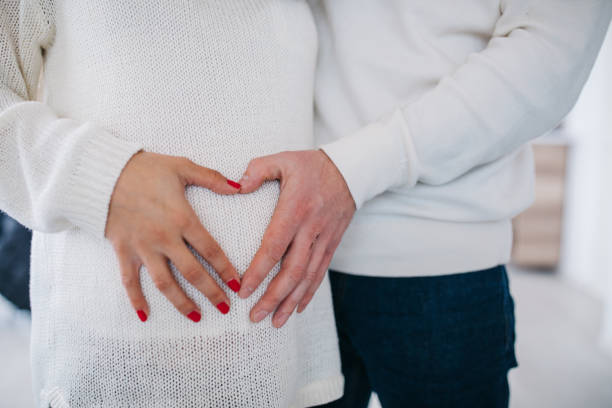 istock Parents hands touching pregnant belly 1131846249