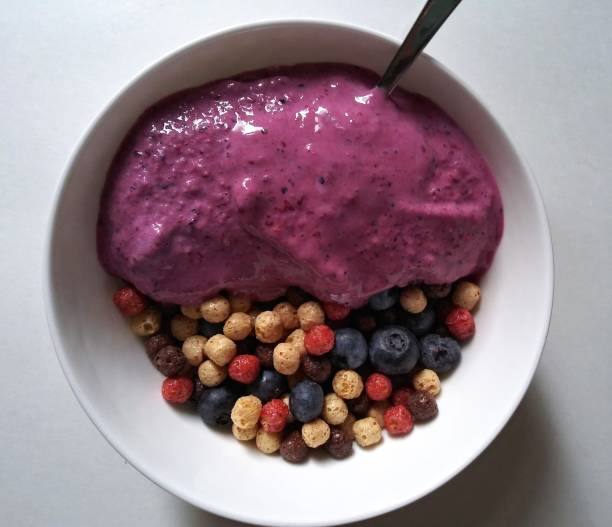 istock Cereal Breakfast with smoothie Berries - chocolate, Strawberry, & Vanila cereal puffs flovored with fresh blueberry 1131846921