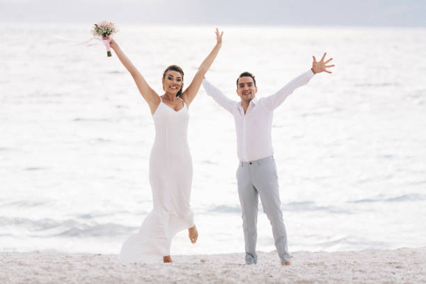 istock Bride and groom on the beach 1131849234