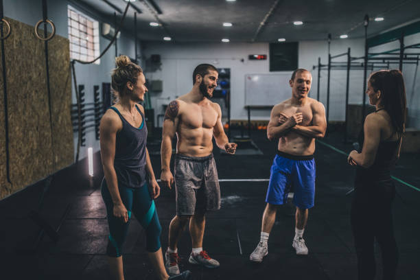 istock Smiling young people relaxing in a gym 1131849429