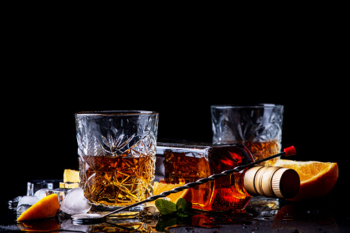 Whiskey on black background, studio shot. Theme of Strong alcohol drinks.