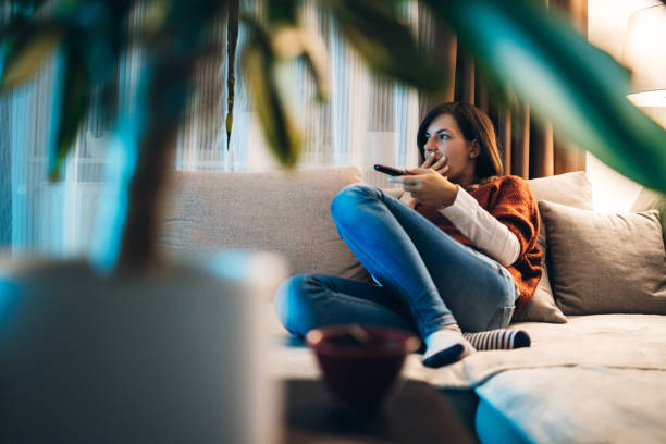 istock Watching TV in hotel room 1131850308
