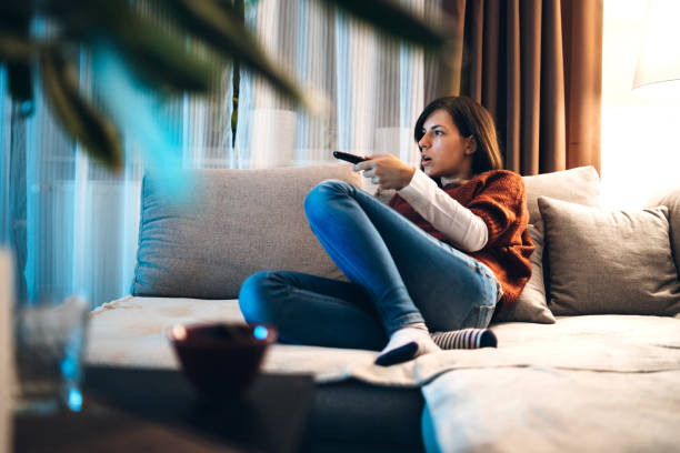 istock Watching TV in hotel room 1131850611