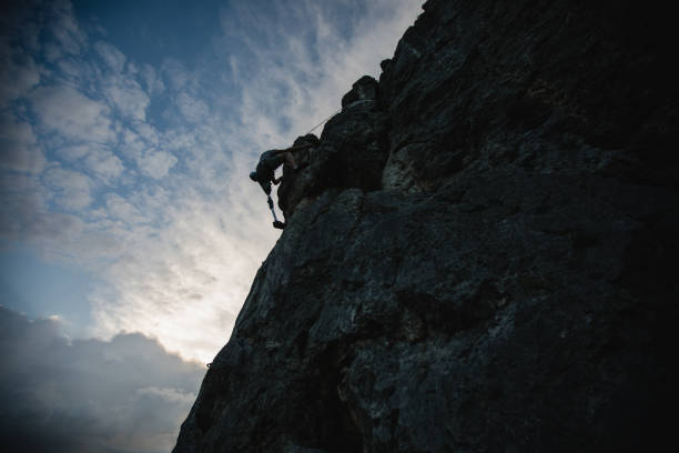 istock Disability strong man free rock climbing 1131850735