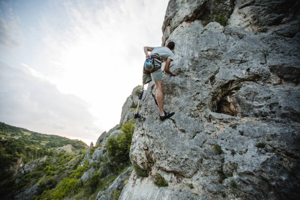 istock Disability man free rock climbing 1131851400