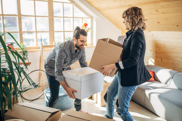 istock Happy couple moving in into new house 1131852043
