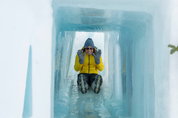 istock Sliding Down an Icy Slide at a Winter Festival 1131853073