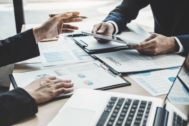 istock Finance manager meeting discussing company growth project success financial statistics, professional investor working start up project for strategy plan with document, laptop and digital tablet 1131855230