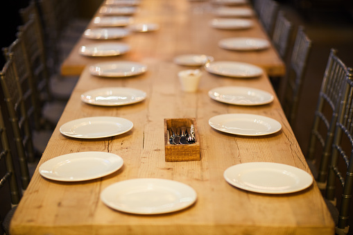 Banquet table with empty plates