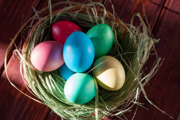 istock Easter eggs on wooden planks 1131857150