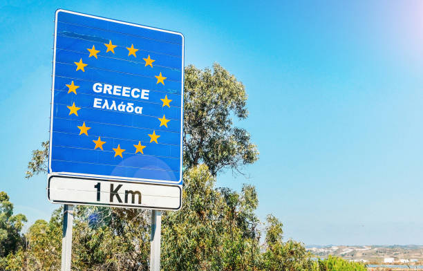 Road sign on the border of Greece as part of an European Union member state Road sign on the border of Greece as part of an European Union member state. schengen agreement photos stock pictures, royalty-free photos & images