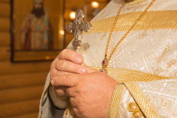 istock The priest holds a crucifix in his hands 1131859017