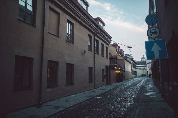 istock Ancient narrow Vilnius street with old architecture and winter background 1131859310
