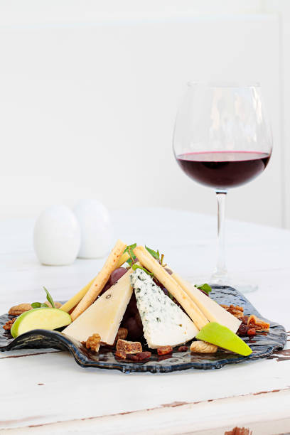 istock Various types of cheese on a plate and red wine 1131859350