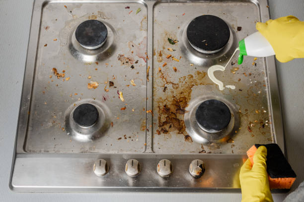 istock Application of detergent on surface of gas stove. 1131860934