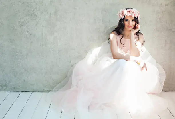 Photo of Beautiful bride woman in tulle roses wedding dress, lifestyle portrait