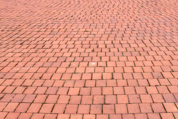 istock Stone pavement of red blocks as a background. 1131861608