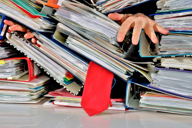 Stress Stress, man is slain by the mountain of files büro stock pictures, royalty-free photos & images