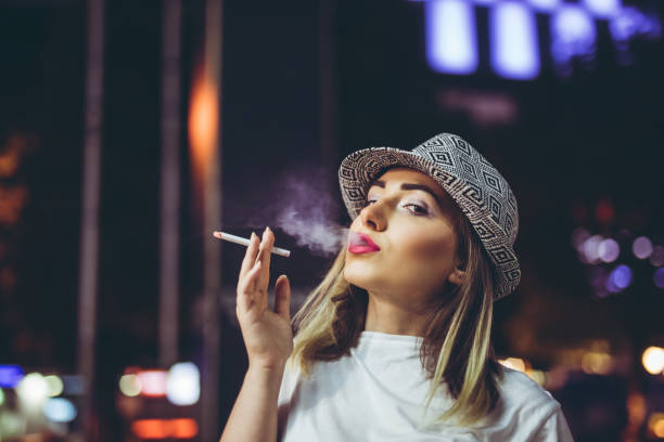 istock Pretty hipster woman with cigarette 1131867623
