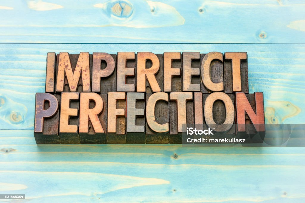imperfect perfection word abstract imperfect perfection word abstract in vintage letterpress wood type printing blocks Concepts Stock Photo