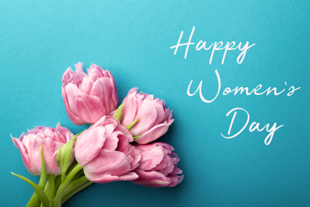istock Pink tulips on turquoise background. 1131868437