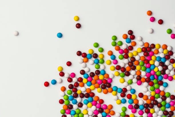 istock Colourful sugar coated chocolate beans on white background 1131869401