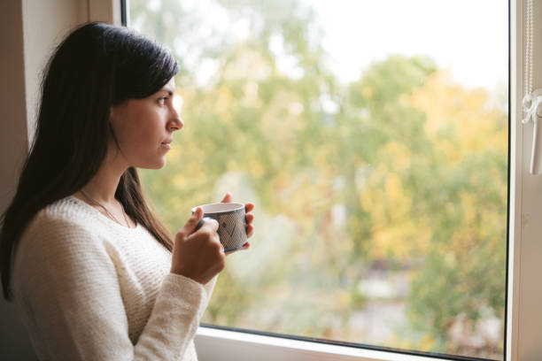 istock Drinking coffee by the window 1131870110