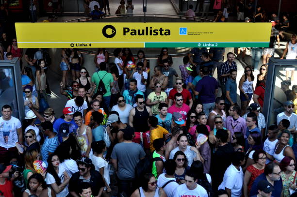 Crowd is going out from Paulista metro station during the LGTB Pride in Sao Paulo LGTB Pride in Sao Paulo is one of the biggest LGTB Parade in the world. It attracs a lot of many, so most of the metro stations during the parade are overcrowded sao paulo gay pride parade stock pictures, royalty-free photos & images