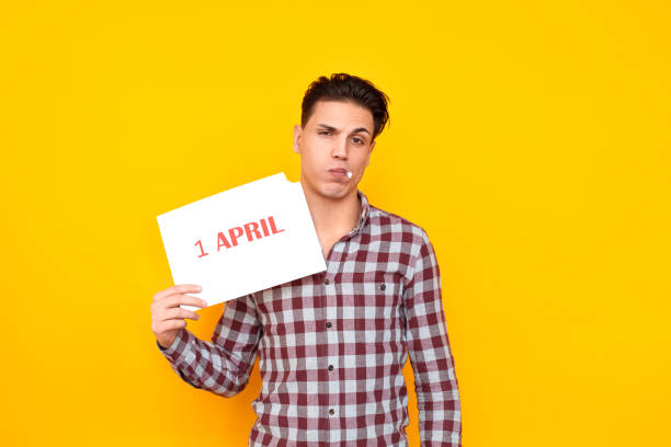 istock Stupid man eating white table with an inscription 1 april 1131871433