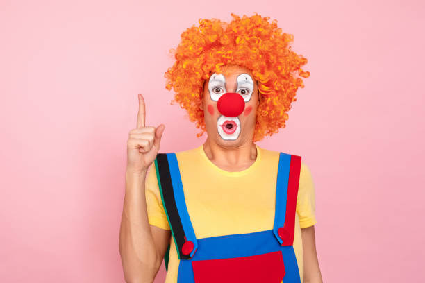 Man in a red wig, overalls and makeup have great idea