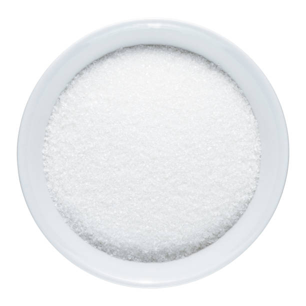 istock Sugar in bowl isolated on white background 1131871712
