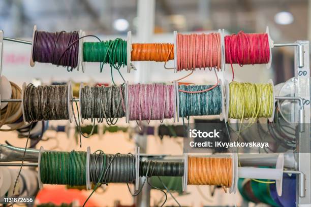 Set Of Spools With Leather Rope Of Different Colors For Sewing Or Crafting On Market Stock Photo - Download Image Now