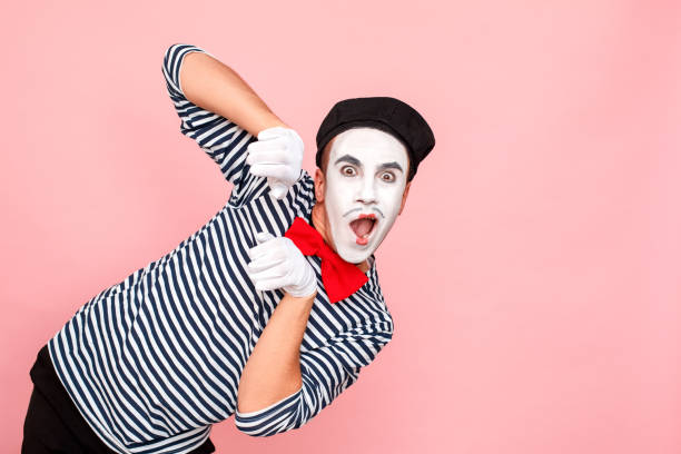istock Shocked man in striped sweater, white gloves with wondered face 1131877003