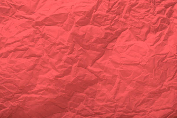 istock Living coral paper wrinkled texture for background and copy-space. 1131877374