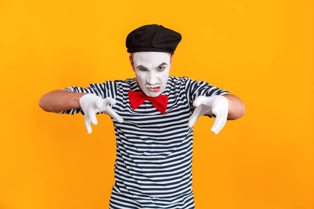 istock Fear concept. Mime man looking angry at camera 1131878395