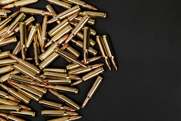 istock Rifle cartridges on a black back 1131878764