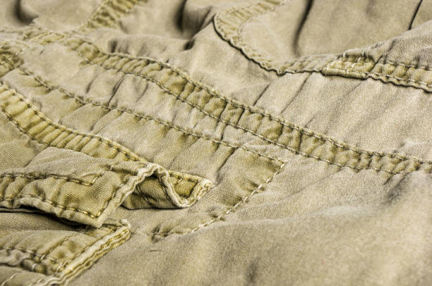 istock clothing items washed cotton fabric texture with seams 1131883114