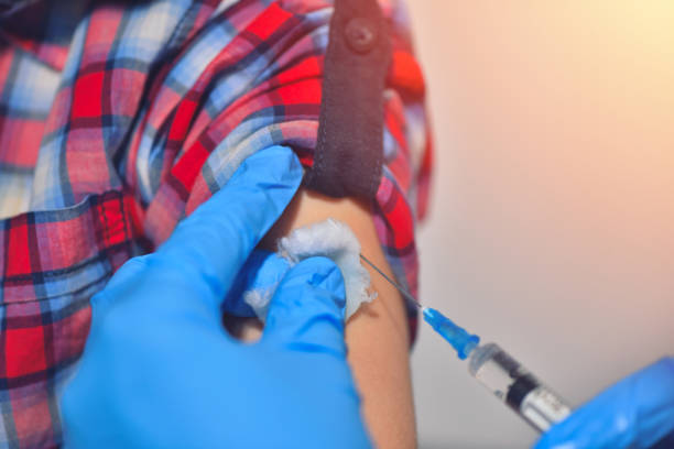 istock Close-up hands doctor or nurses are vaccination to patient using the syringe injected upper arm for treated. Doctor giving an injection to a patient 1131884434