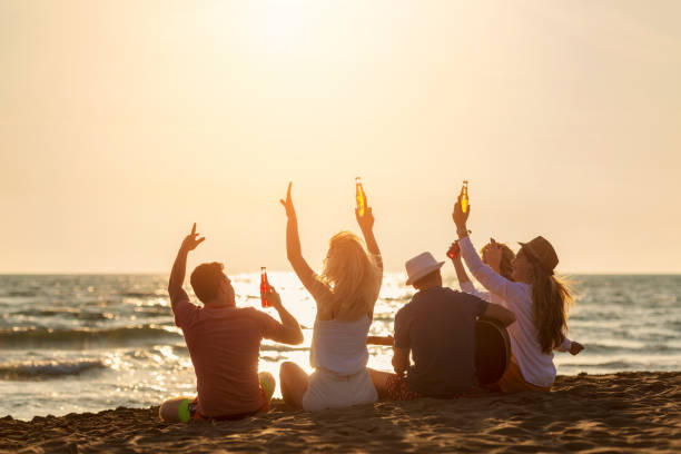 istock Group of friends on the beach enjoy 1131884465