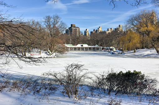 The Lake in Central Park, New York frozen over during wintertime.