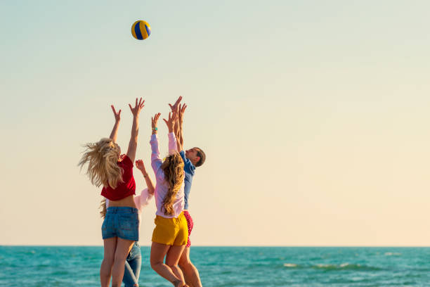 istock Group of friends on the beach enjoy 1131886222